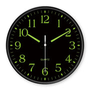 Lumis silent wall clock with luminous hands on a white background